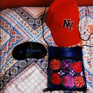 crossbody purse, New York cap, & DND sleeping mask